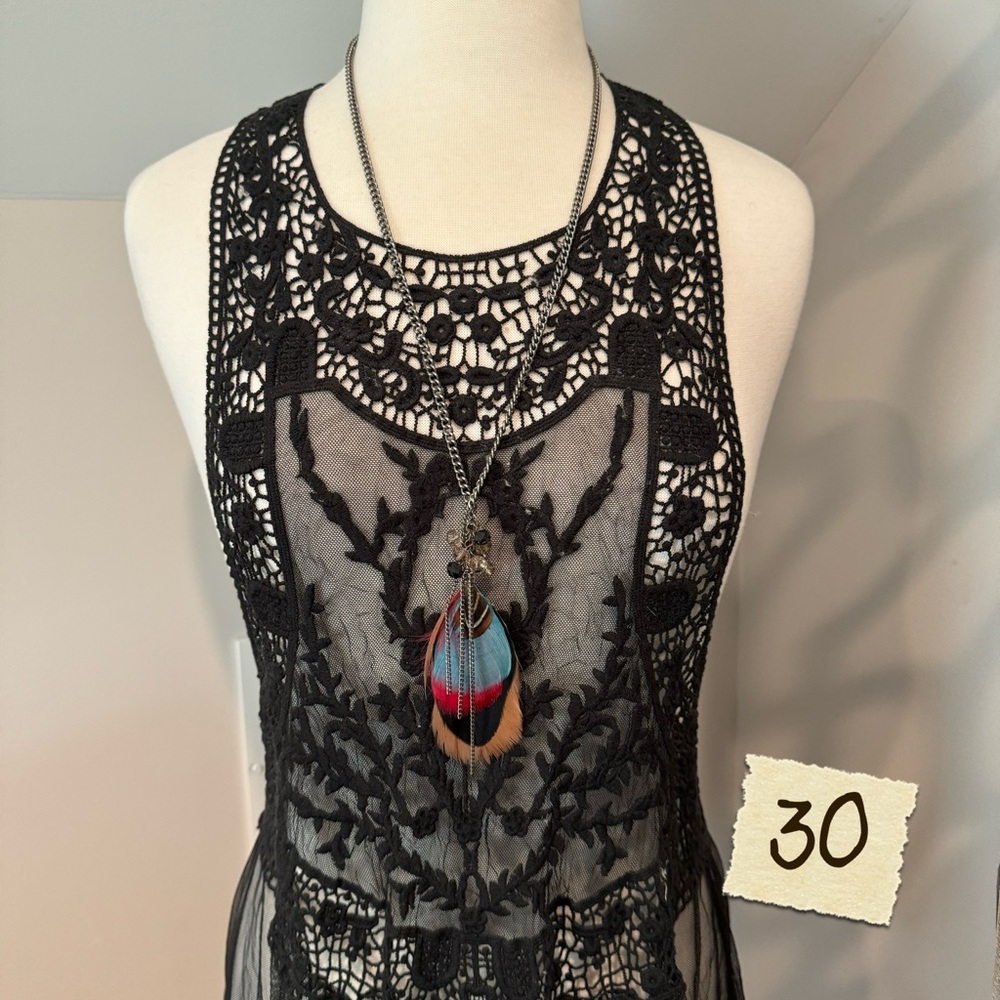 Long multi colored feather necklace.